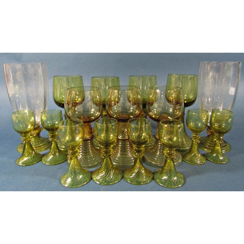 1153 - Fifteen near matching pale olive green spiral beehive wine glasses of varying sizes, and two similar... 