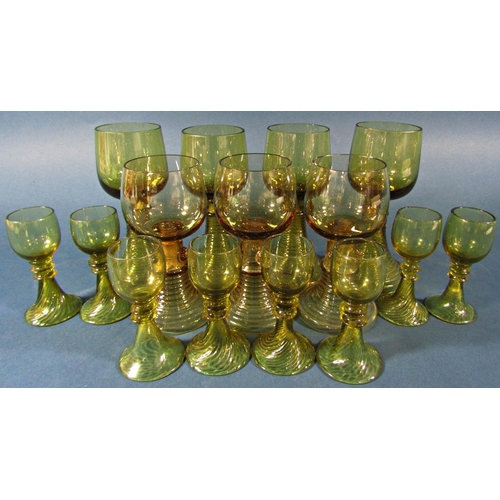 1153 - Fifteen near matching pale olive green spiral beehive wine glasses of varying sizes, and two similar... 