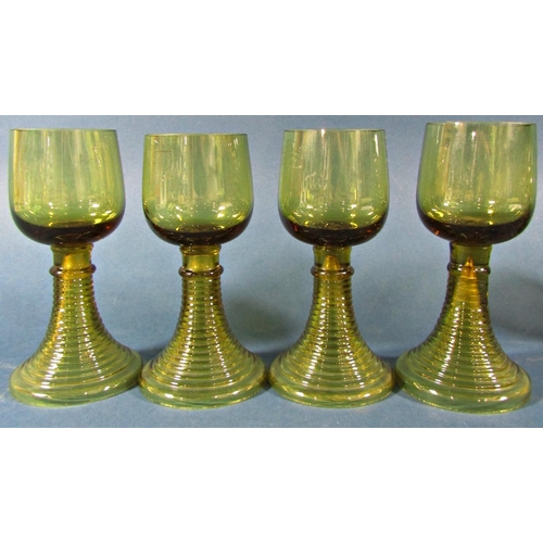 1153 - Fifteen near matching pale olive green spiral beehive wine glasses of varying sizes, and two similar... 