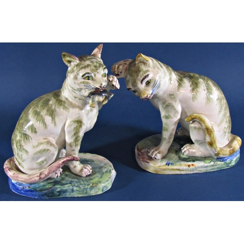 1048 - A pair of continental majolica cats, one holding a rat, three further pairs of 19th century Stafford... 