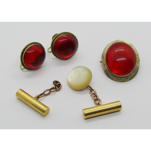 1315 - Yellow metal brooch set with a cabochon simulated red stone, together with a matched pair of 9ct ear... 