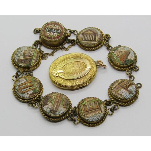 1330 - Antique yellow metal locket with belt motif and further ornately engraved decoration, 5.3g, together... 