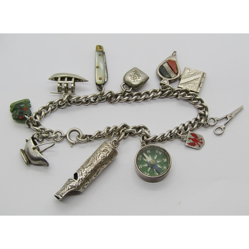 1398 - Group of three silver charm bracelets and loose charms, charms to include a Maori jade Tiki, mother ... 