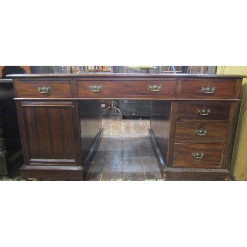 2608 - A Victorian mahogany partners desk with inset leather top, each side fitted with six drawers and a c... 