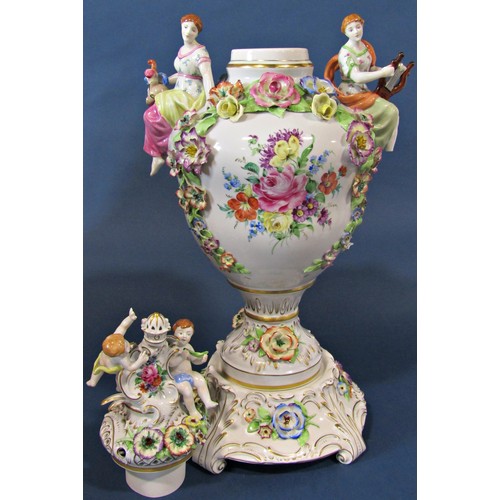 1052 - A substantial continental porcelain oviform vase and cover in the Dresden style, with hand painted f... 