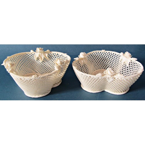 1007 - A collection of Belleek ware including a pair of trefoil shaped basket weave dishes, bee skep and co... 