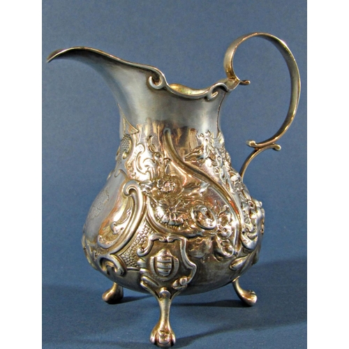 1224 - A Victorian silver milk jug with floral embossed decoration, London 1845, maker Henry Holland, 5.2oz... 