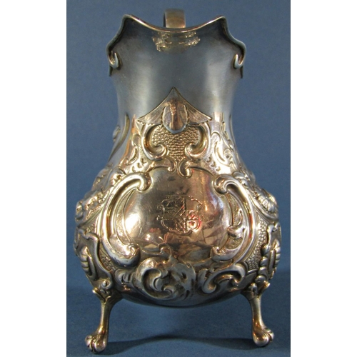 1224 - A Victorian silver milk jug with floral embossed decoration, London 1845, maker Henry Holland, 5.2oz... 