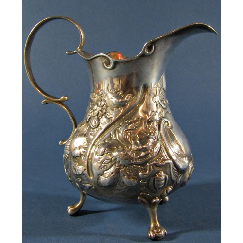 1224 - A Victorian silver milk jug with floral embossed decoration, London 1845, maker Henry Holland, 5.2oz... 