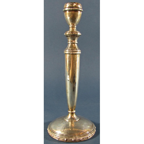 1231 - A single silver candlestick, 23cm tall, Birmingham 1972, makers mark rubbed, together with a cased s... 