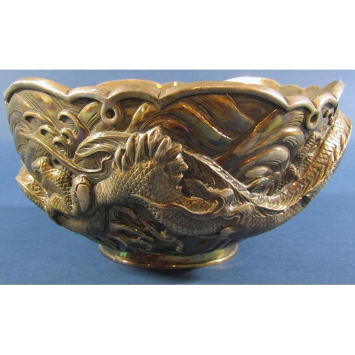 1237 - A Japanese silver metal bowl with entwined dragons and a faint makers stamp to base, 17.5cm diameter... 