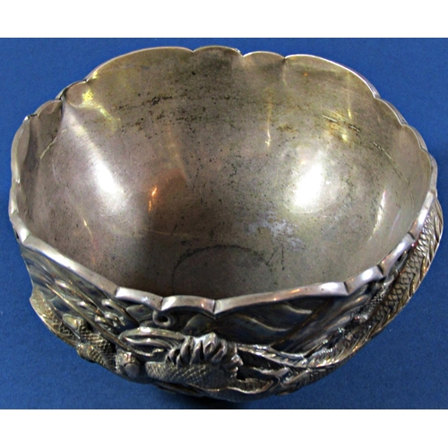 1237 - A Japanese silver metal bowl with entwined dragons and a faint makers stamp to base, 17.5cm diameter... 