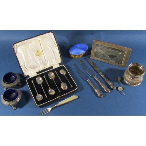 1241 - A cased set of six coffee spoons, two Victorian salt cauldrons, a silver beaker, a silver photo fram... 