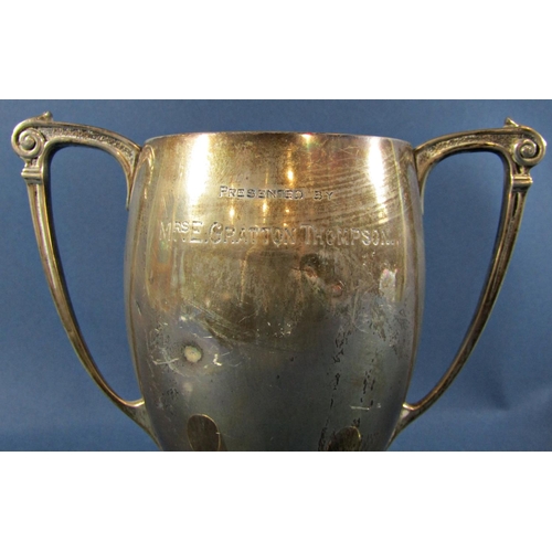 1242 - A 1930s silver twin handled trophy, London 1935, maker Henry Hodson Plante, 18cm high, together with... 