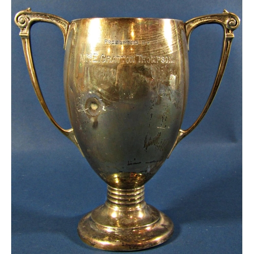 1242 - A 1930s silver twin handled trophy, London 1935, maker Henry Hodson Plante, 18cm high, together with... 