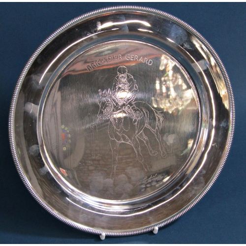 1257 - A silver dish, 23 cm in diameter etched with the image of the racehorse Brigadier Gerard with Joe Me... 