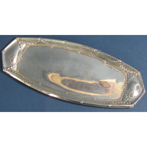 1259 - An Edwardian silver boat shaped dish with embossed detail  and presentation script, to small pepper ... 