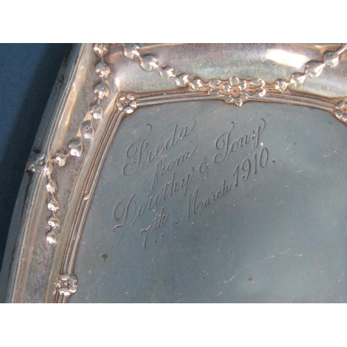 1259 - An Edwardian silver boat shaped dish with embossed detail  and presentation script, to small pepper ... 