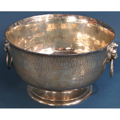 1260 - A good hammered silver presentation bowl with lion mask and ring handles raised on a turned foot 29c... 