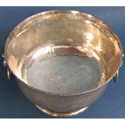 1260 - A good hammered silver presentation bowl with lion mask and ring handles raised on a turned foot 29c... 