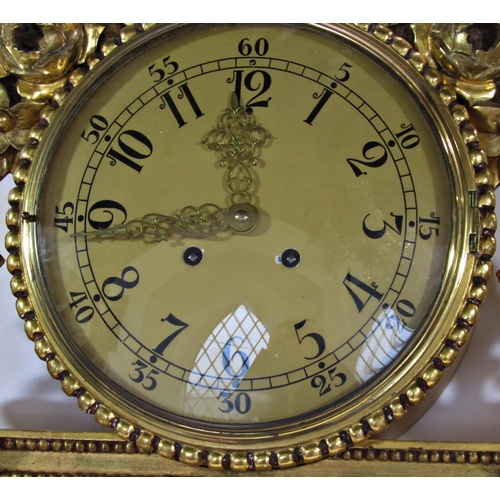 1455 - A gilded wall clock the decorative casework with column, floral and ribbon detail enclosing an eight... 