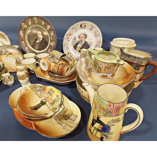 1021 - A collection of royal Doulton dickens ware comprising dishes of various shapes, tea cups and saucers... 