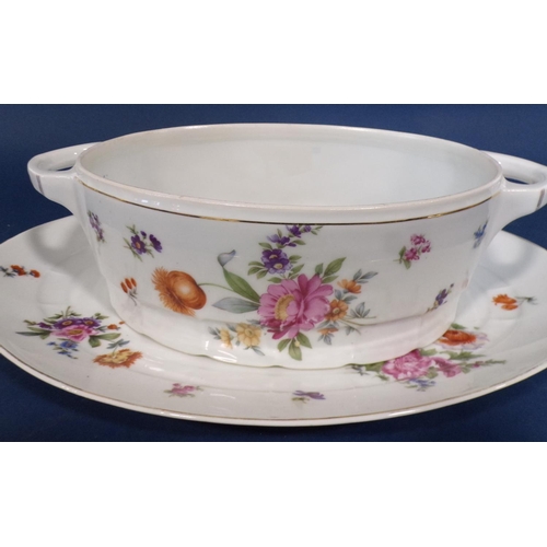 1029 - A Czechoslovakian porcelain dinner service with floral bouquet detail comprising dinner plates, soup... 