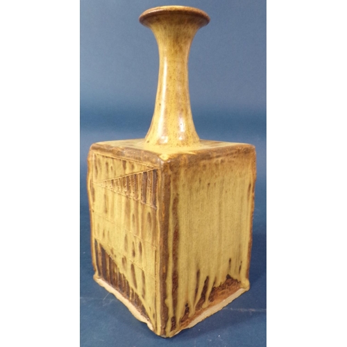 1046 - A studio pottery pot of square cut form with trumpet shaped neck, with simple geometric detail