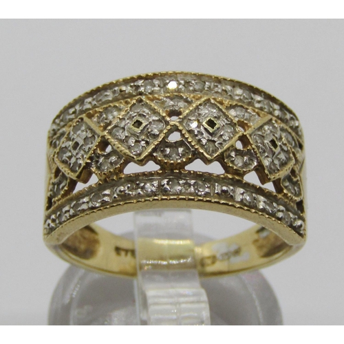 1310 - 9ct diamond ring with pierced geometric decoration, size P, 4g