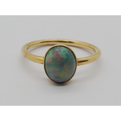 1317 - Yellow metal ring set with a cabochon opal in collet setting, size O/P, 2.4g