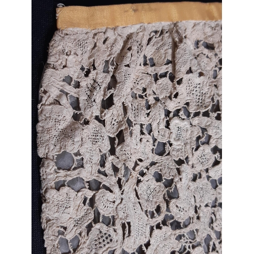 1550 - A 19th century Honiton lace bertha with raised and rolled detail, lined with fine gauze and with one... 