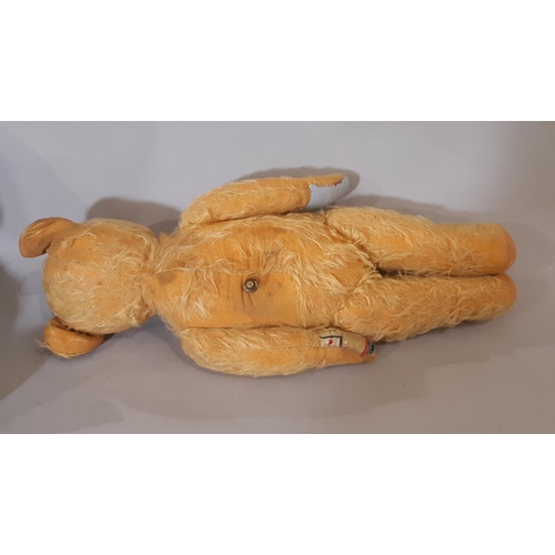 314 - Musical teddy bear, mid 20th century with jointed body, stitched nose and mouth, worn golden plush, ... 