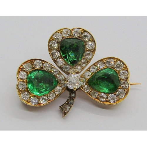 1354 - Fine late Victorian yellow metal emerald and diamond shamrock brooch, set with a pear-cut emerald to... 
