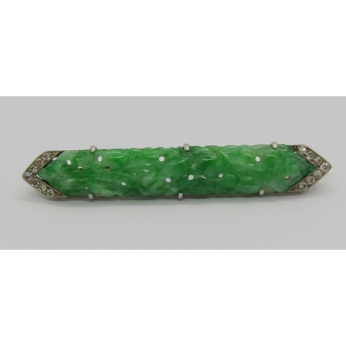 1359 - Art Deco white metal jade and diamond brooch with carved and pierced detail, 4.7cm w approx, 5.4g