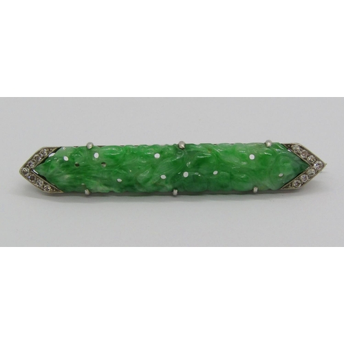 1359 - Art Deco white metal jade and diamond brooch with carved and pierced detail, 4.7cm w approx, 5.4g