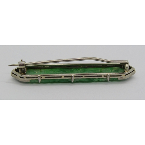 1359 - Art Deco white metal jade and diamond brooch with carved and pierced detail, 4.7cm w approx, 5.4g