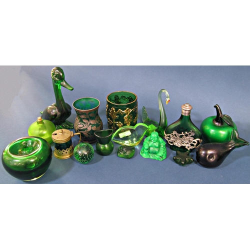 1157 - A collection of twenty eight pieces of green glass ornaments and glass ware, including vases, animal... 