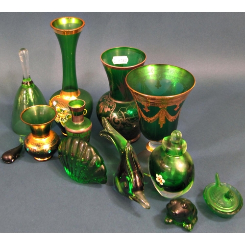 1157 - A collection of twenty eight pieces of green glass ornaments and glass ware, including vases, animal... 