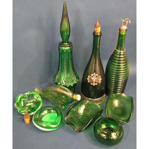 1163 - A collection of eighteen pieces of green glass including, ashtrays, bowls, ice bucket, bottles, vase... 