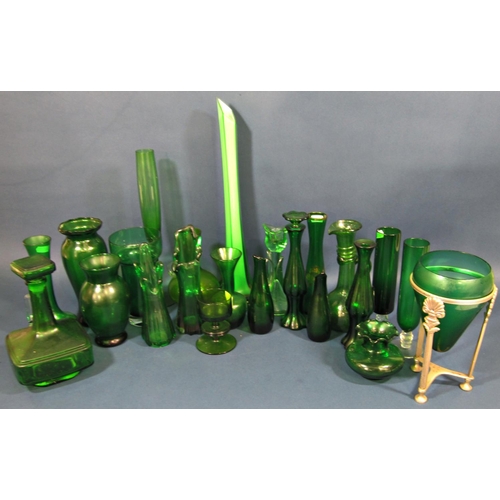 1168 - A collection of twenty three pieces of green glass mainly vases of varying shapes and sizes etc.