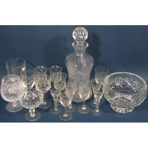 1174 - A collection of glassware including a tall narrow cut glass vase, three various decanters, a fruit b... 