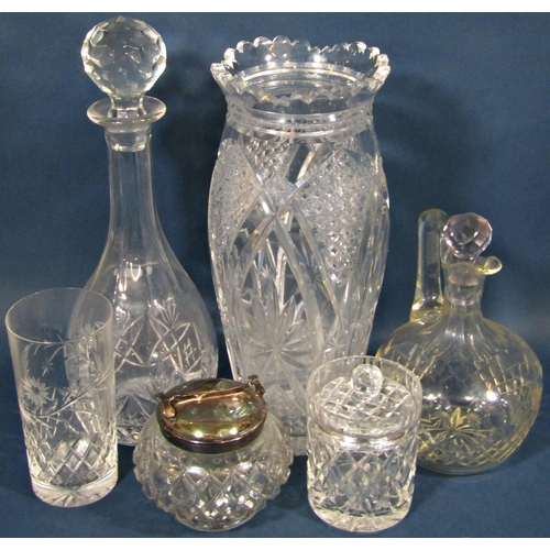 1174 - A collection of glassware including a tall narrow cut glass vase, three various decanters, a fruit b... 