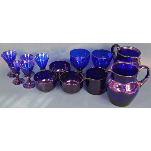 1183 - A collection of nineteen pieces of Bristol Blue glassware, including two decanters, five bowls, four... 