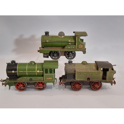 302 - O gauge Hornby railway collection comprising clockwork locomotives, wagons and track; includes 3x 0-... 