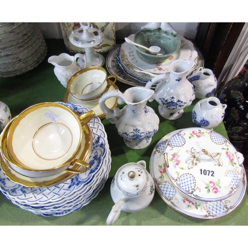 1072 - A miscellaneous collection of ceramics including a butter dish, cover and stand, two tin glazed ewer... 