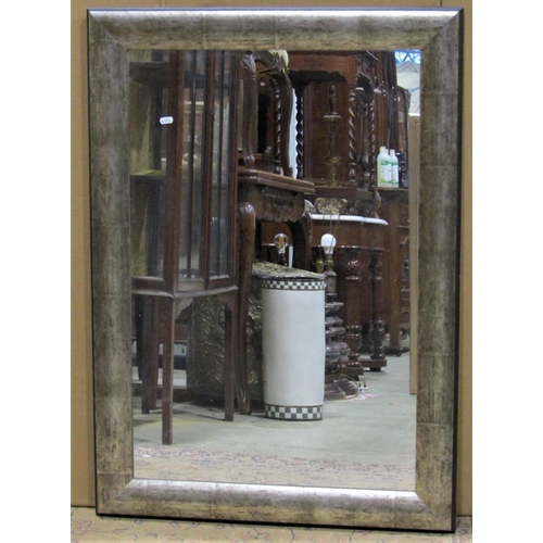2411 - Two contemporary rectangular wall mirrors of varying design, the largest example 122 cm x 97 cm, the... 