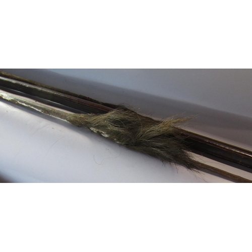 1690 - Two Tribal spears (as found) 145cm and 134cm a Tribal wooden spear launcher 149cm and a wooden Papua... 