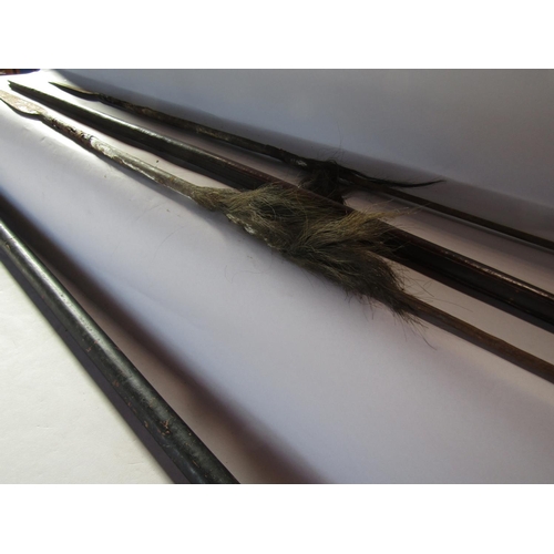 1690 - Two Tribal spears (as found) 145cm and 134cm a Tribal wooden spear launcher 149cm and a wooden Papua... 