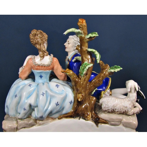 1443 - A contemporary porcelain mantle clock in the romantic style, surmounted by male and female character... 