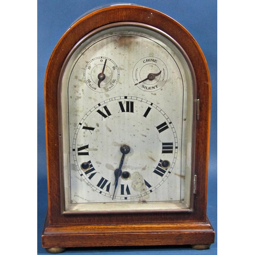 1447 - An Edwardian mahogany bracket clock, the arched silvered dial with chime/silent selector, regulator,... 